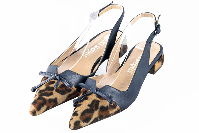 Safari black and denim blue women's open back shoes, with a knot. Pointed toe. Flat flare heels. Front view - Florence KOOIJMAN